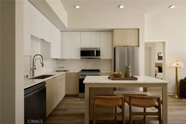 a bathroom with a double vanity sink and mirror