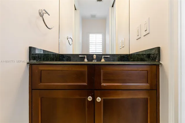 a kitchen with stainless steel appliances a refrigerator and a sink