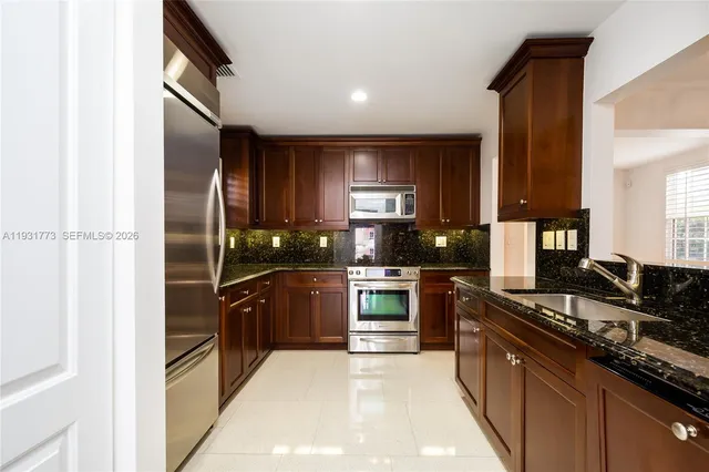 a view of a hallway with washer and dryer