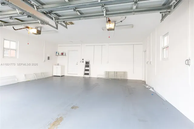 a view of swimming pool with lounge chairs in patio