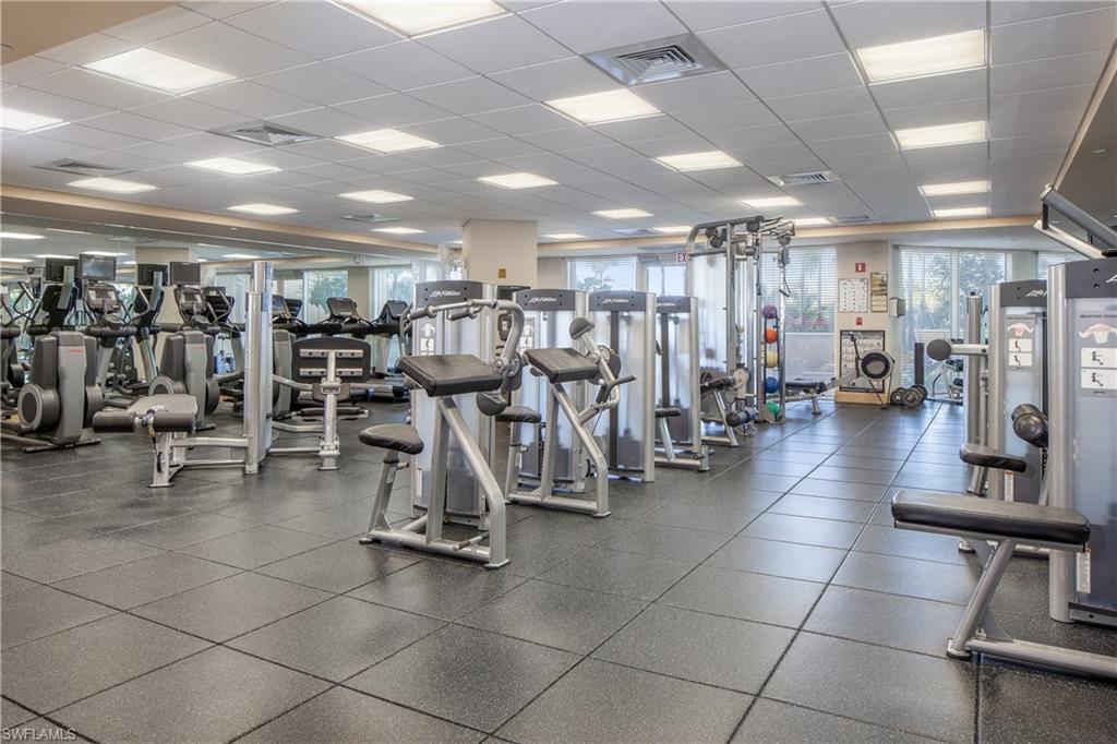 7117 Pelican Bay Boulevard, Unit 206 Naples, FL 34108 - Photo 23 of 35 a view of a room with gym equipment