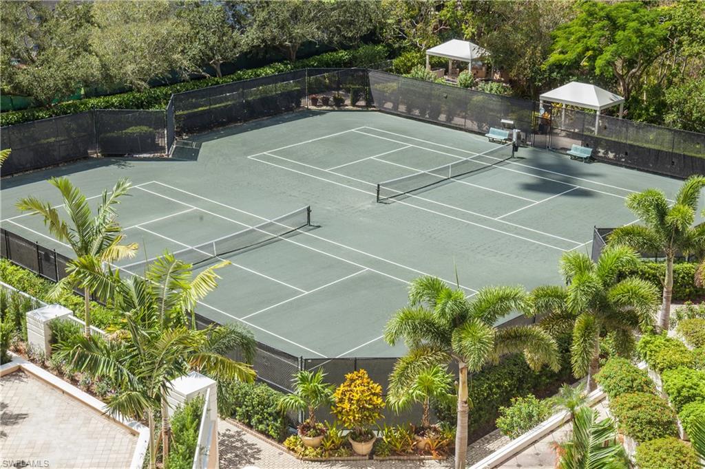 7117 Pelican Bay Boulevard, Unit 206 Naples, FL 34108 - Photo 24 of 35 a tennis court view
