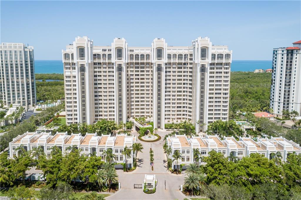 7117 Pelican Bay Boulevard, Unit 206 Naples, FL 34108 - Photo 30 of 35 a view of a city with tall buildings