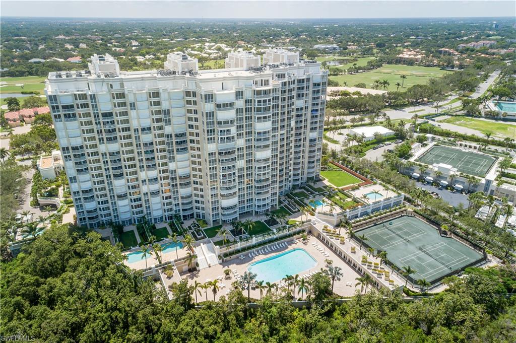 7117 Pelican Bay Boulevard, Unit 206 Naples, FL 34108 - Photo 31 of 35 a view of a city with tall buildings