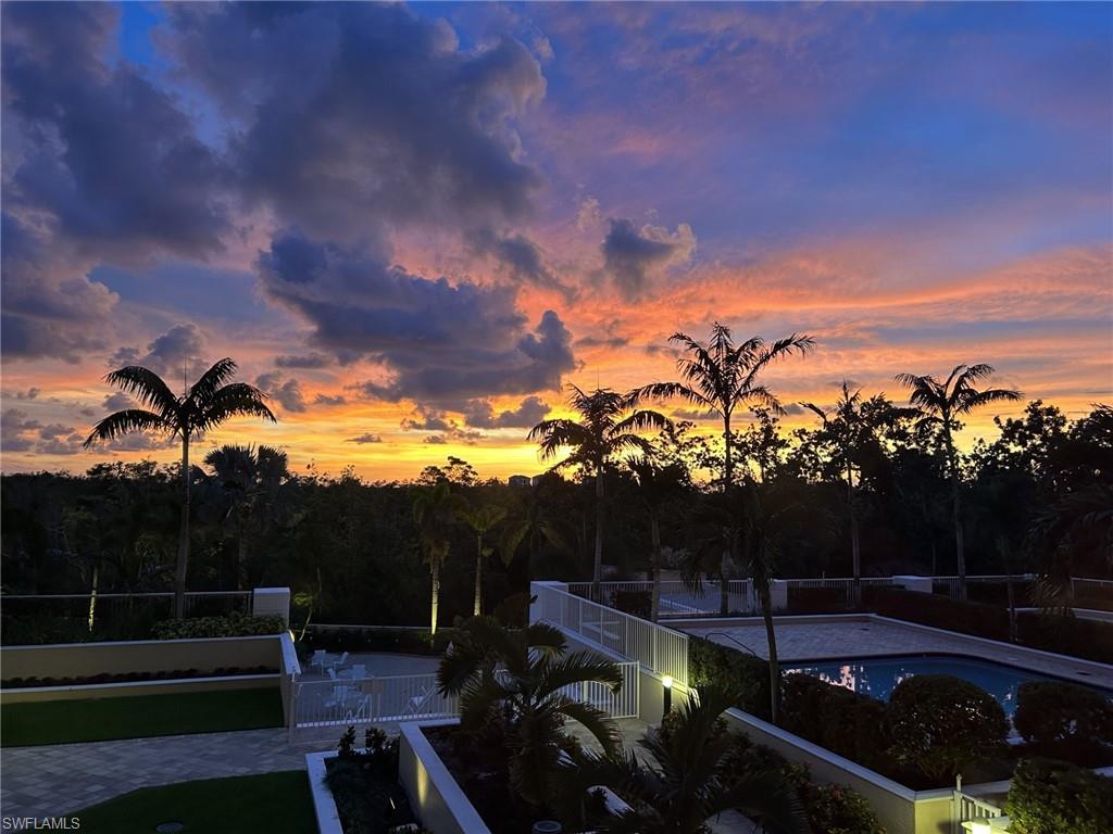7117 Pelican Bay Boulevard, Unit 206 Naples, FL 34108 - Photo 9 of 35 a view of a terrace with a yard