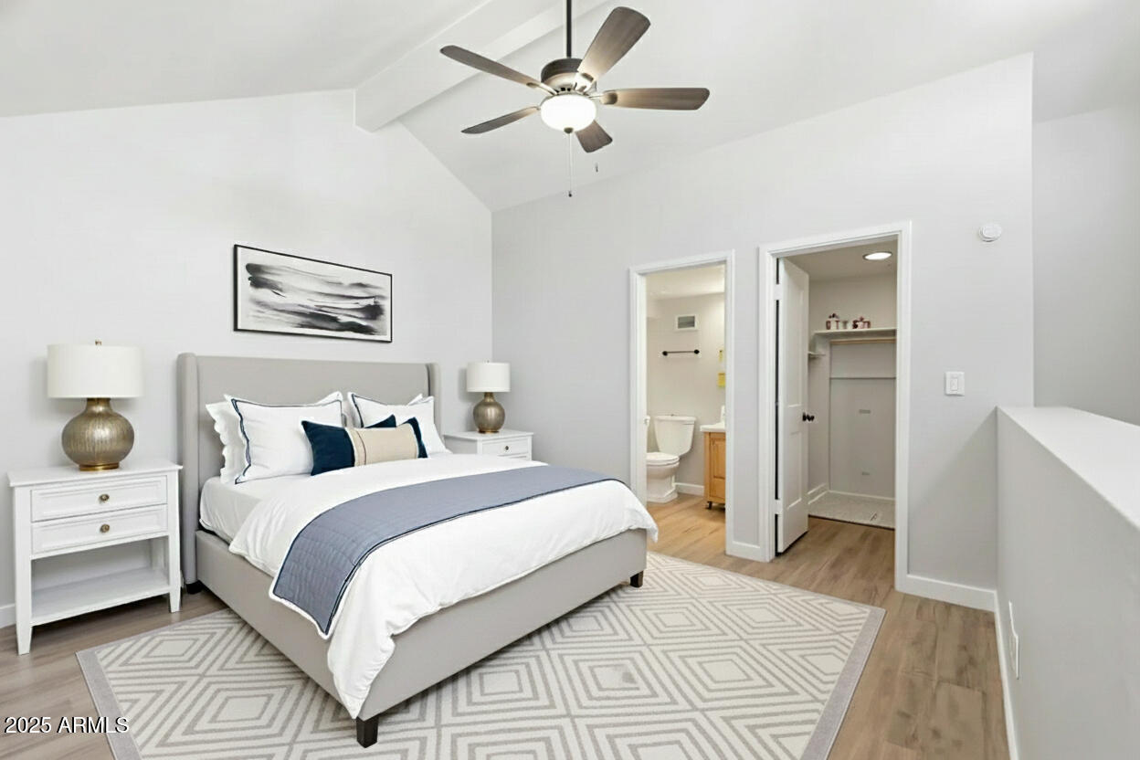 30 East Brown Road, Unit 2081 Mesa, AZ 85201 - Photo 10 of 19 a bedroom with bed and a chandelier