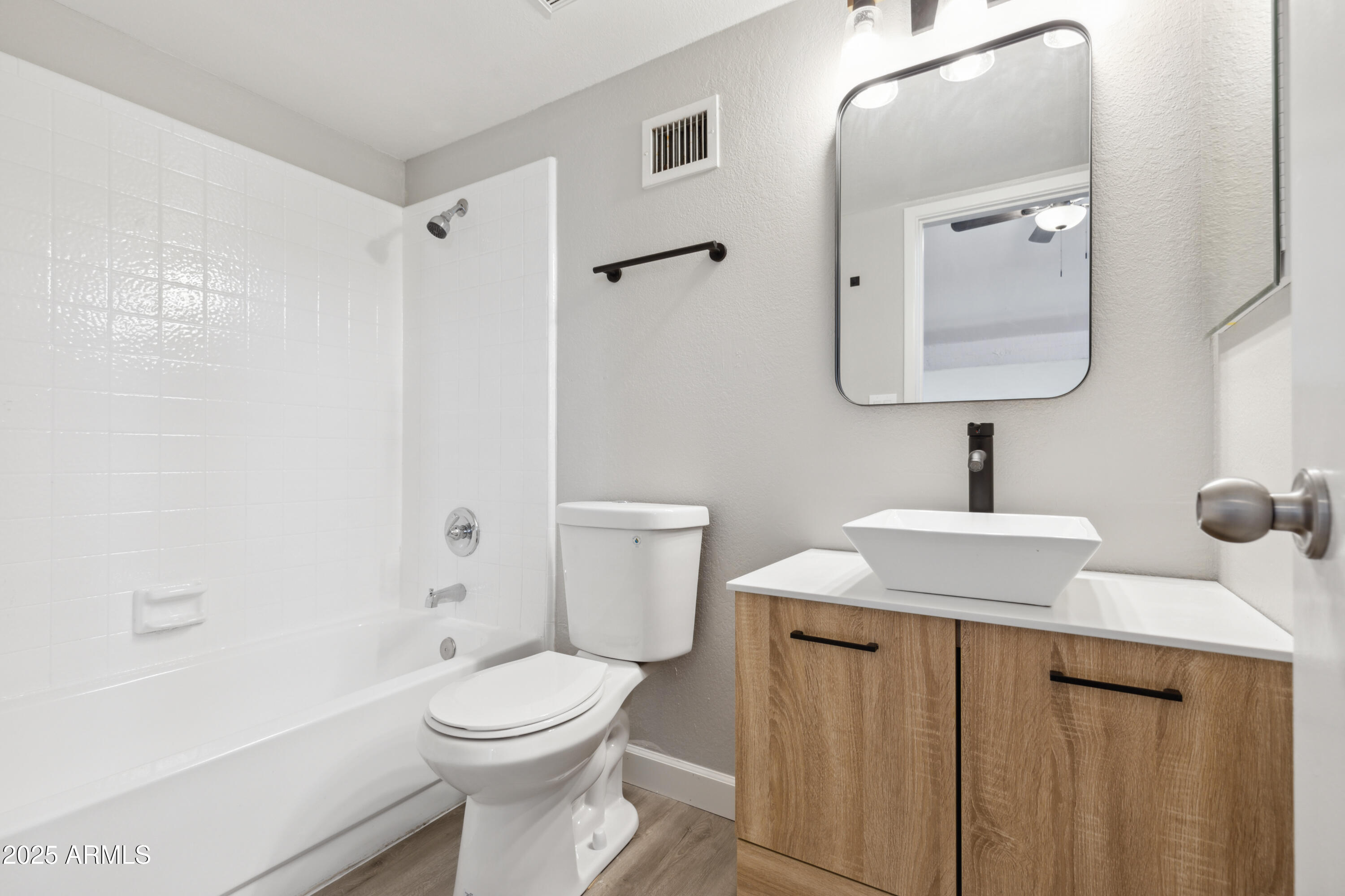 30 East Brown Road, Unit 2081 Mesa, AZ 85201 - Photo 13 of 19 a bathroom with a toilet a sink and mirror