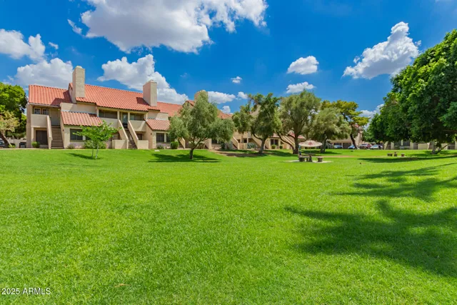 a front view of a building with garden