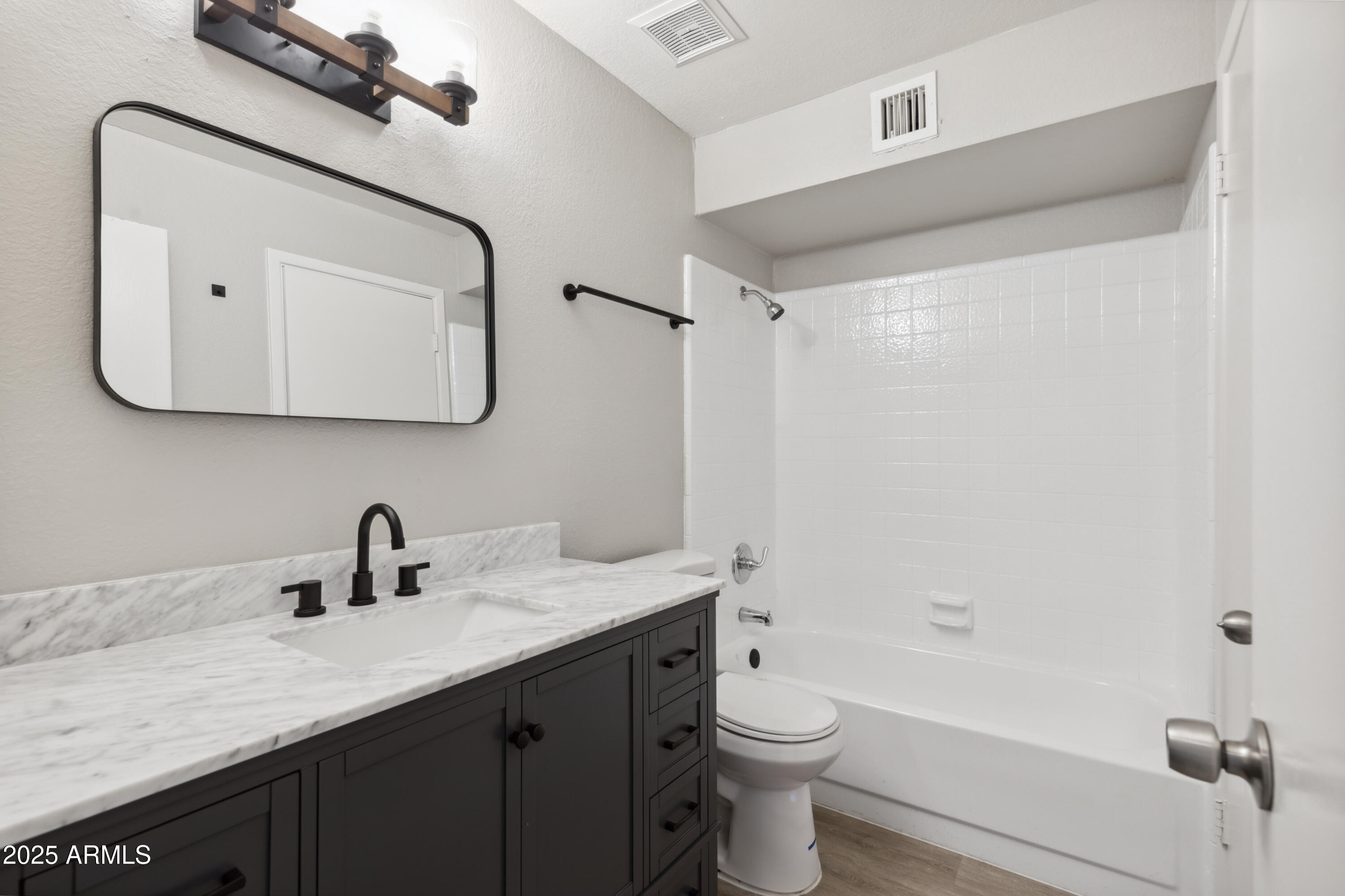 30 East Brown Road, Unit 2081 Mesa, AZ 85201 - Photo 9 of 19 a bathroom with a sink a toilet and shower