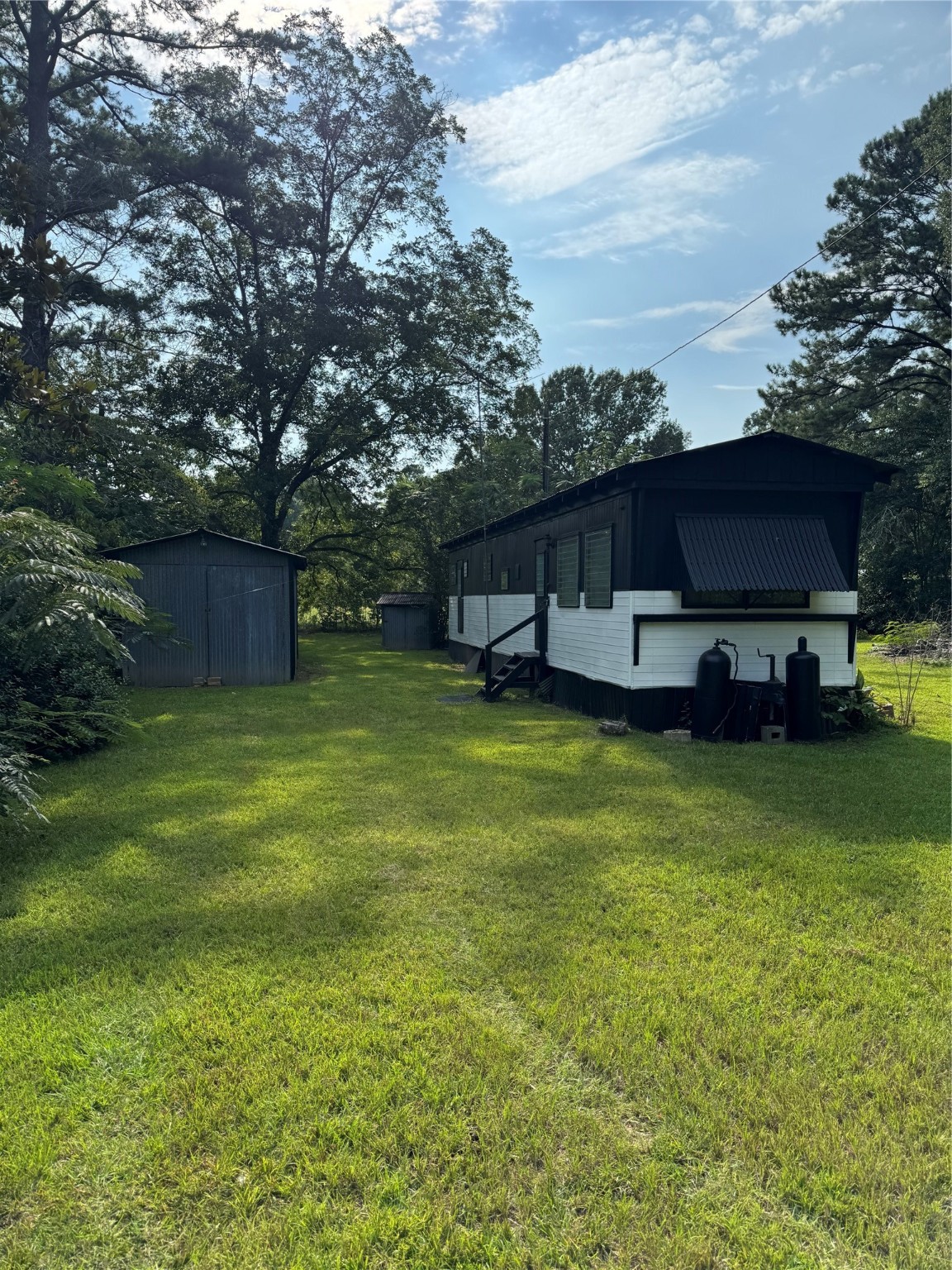 140 Azalea Drive Jasper, TX 75951 - Photo 2 of 9 a view of a house with a big yard