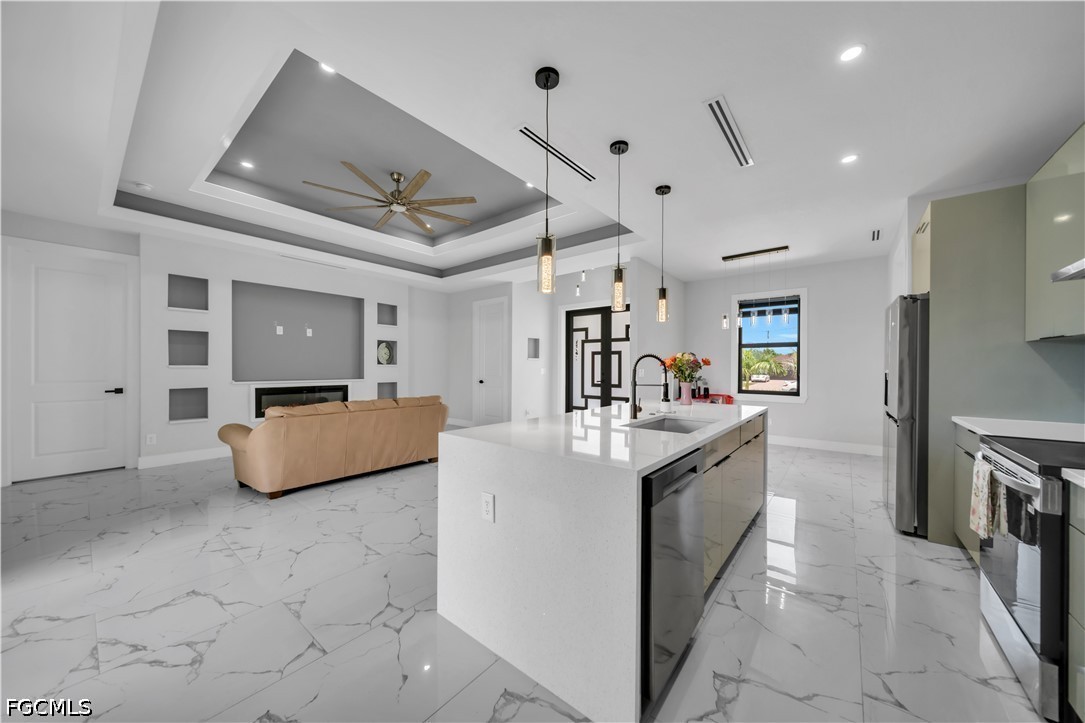1128 Nelson Road North Cape Coral, FL 33993 - Photo 7 of 22 a large white kitchen with a large window