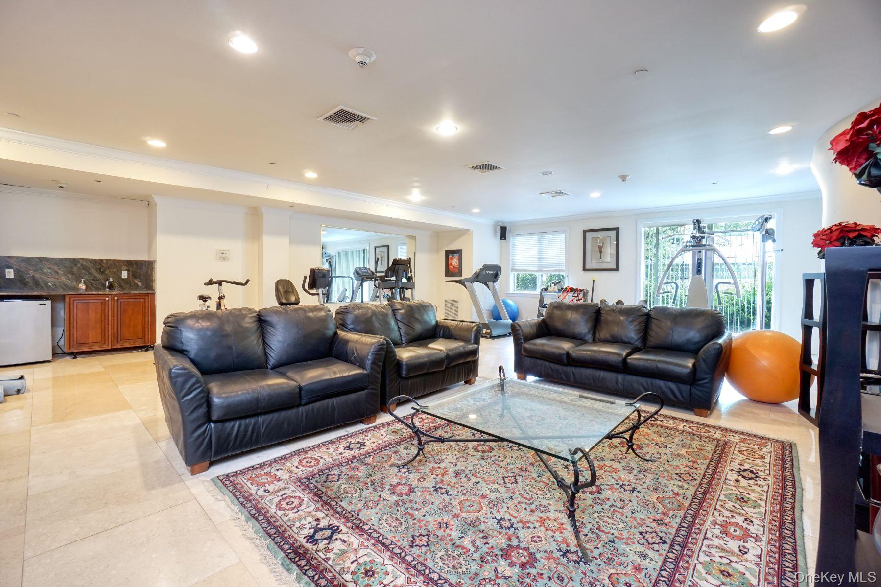 171 Great Neck Road, Unit 4E Great Neck, NY 11021 - Photo 12 of 15 Living area featuring crown molding and recessed lighting