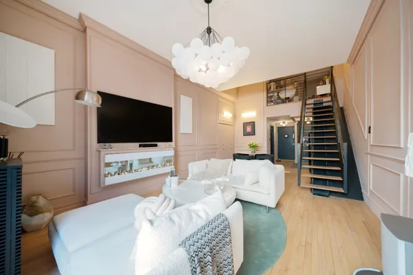 a living room with furniture and a flat screen tv