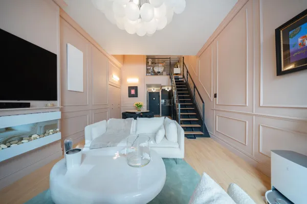 a living room with furniture and a flat screen tv