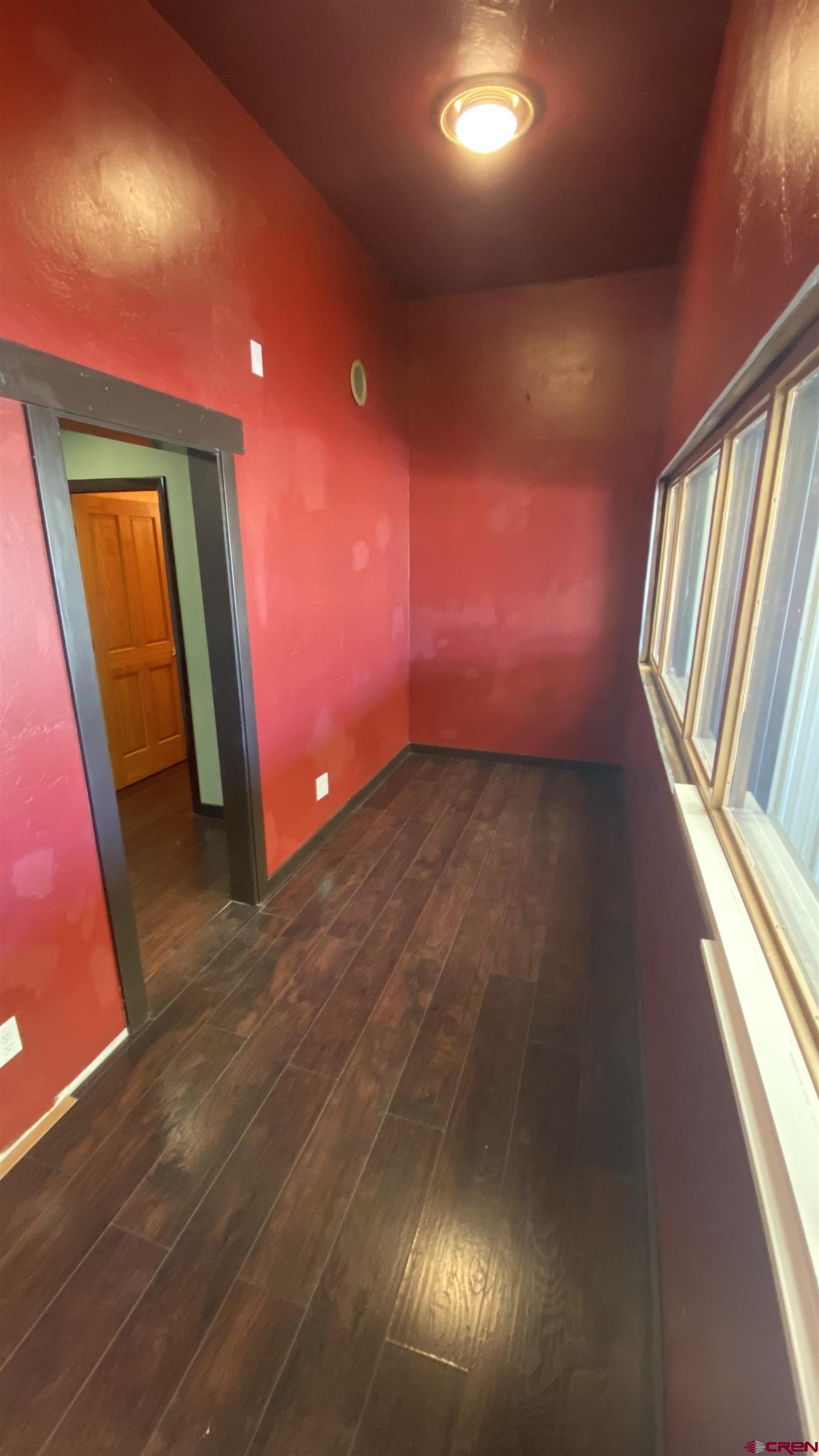 146 Sawyer Drive, Unit C Durango, CO 81303 - Photo 3 of 8 an empty room with windows