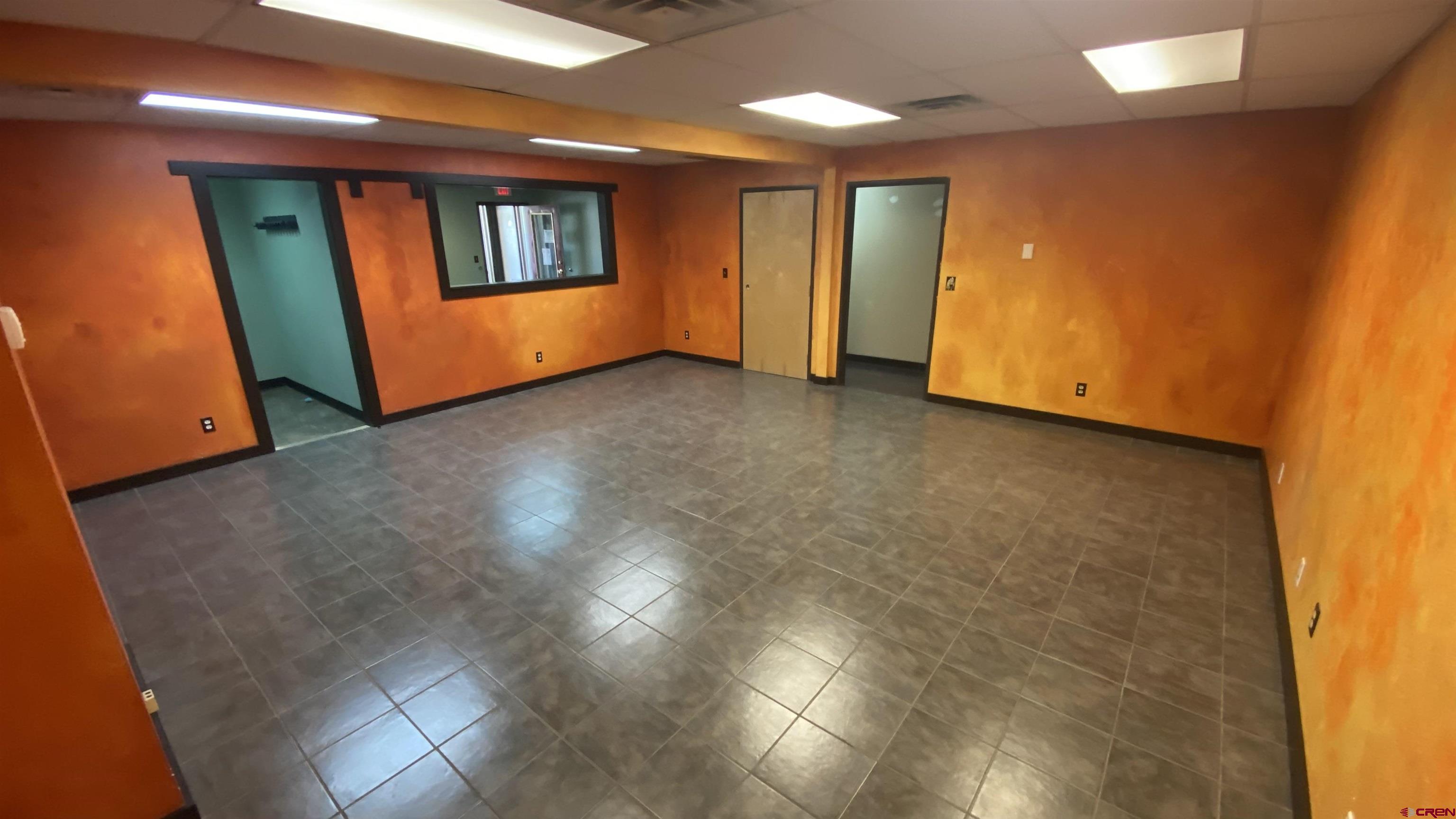 146 Sawyer Drive, Unit C Durango, CO 81303 - Photo 7 of 8 a view of an empty room with window and wooden floor