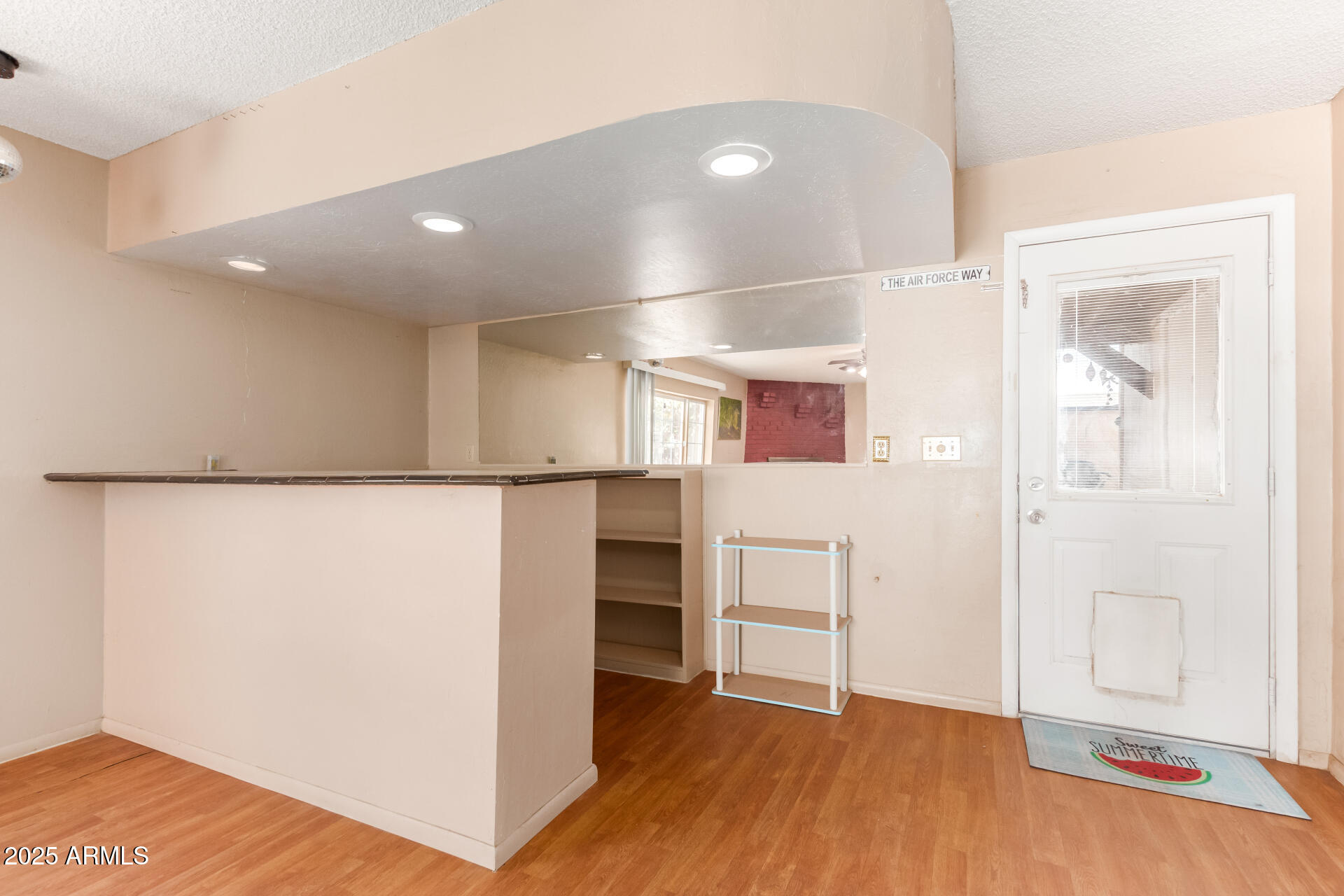 3251 West Cortez Avenue Phoenix, AZ 85029 - Photo 11 of 32 a view of empty room with wooden floor