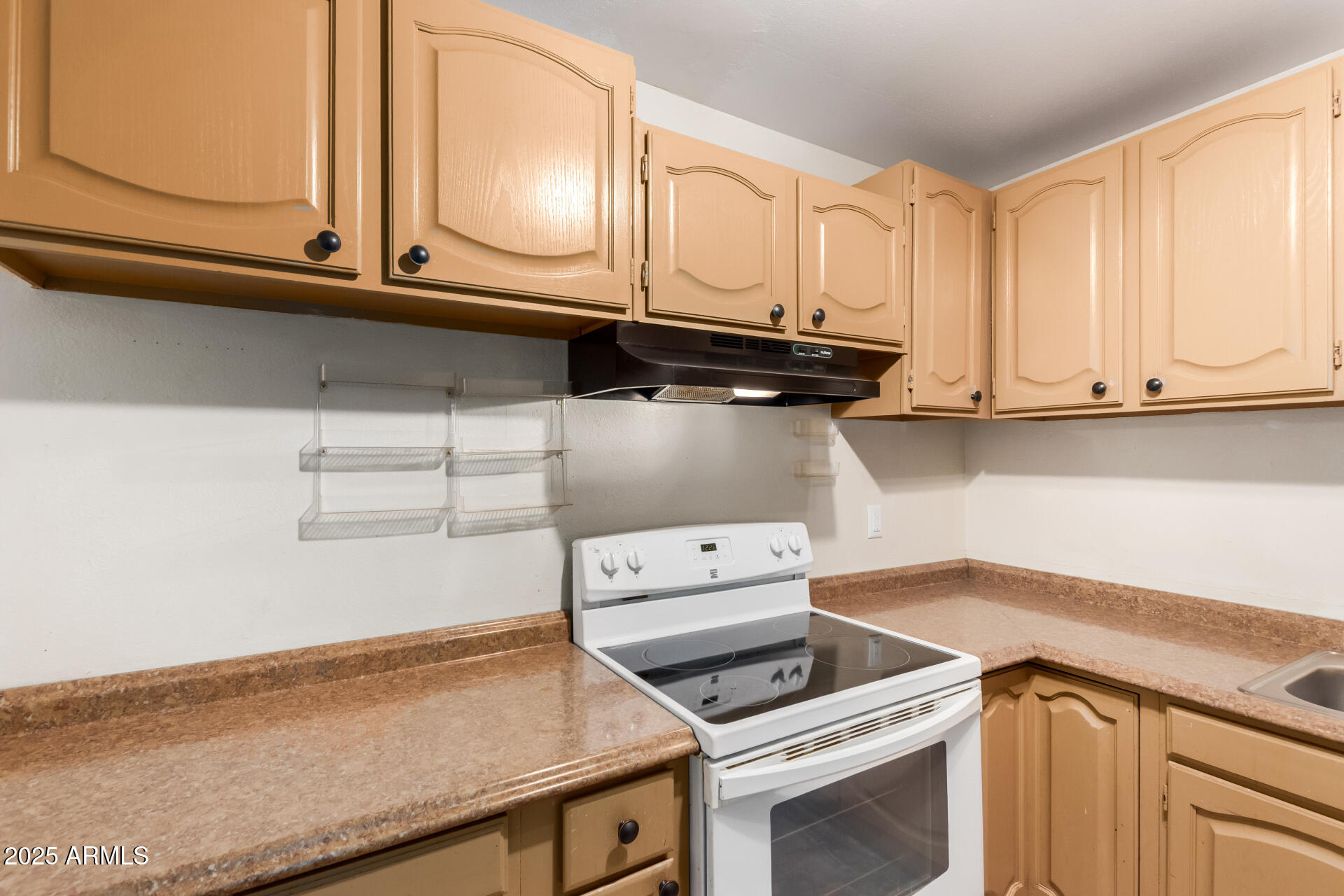 3251 West Cortez Avenue Phoenix, AZ 85029 - Photo 14 of 32 a kitchen with appliances cabinets and a counter top space