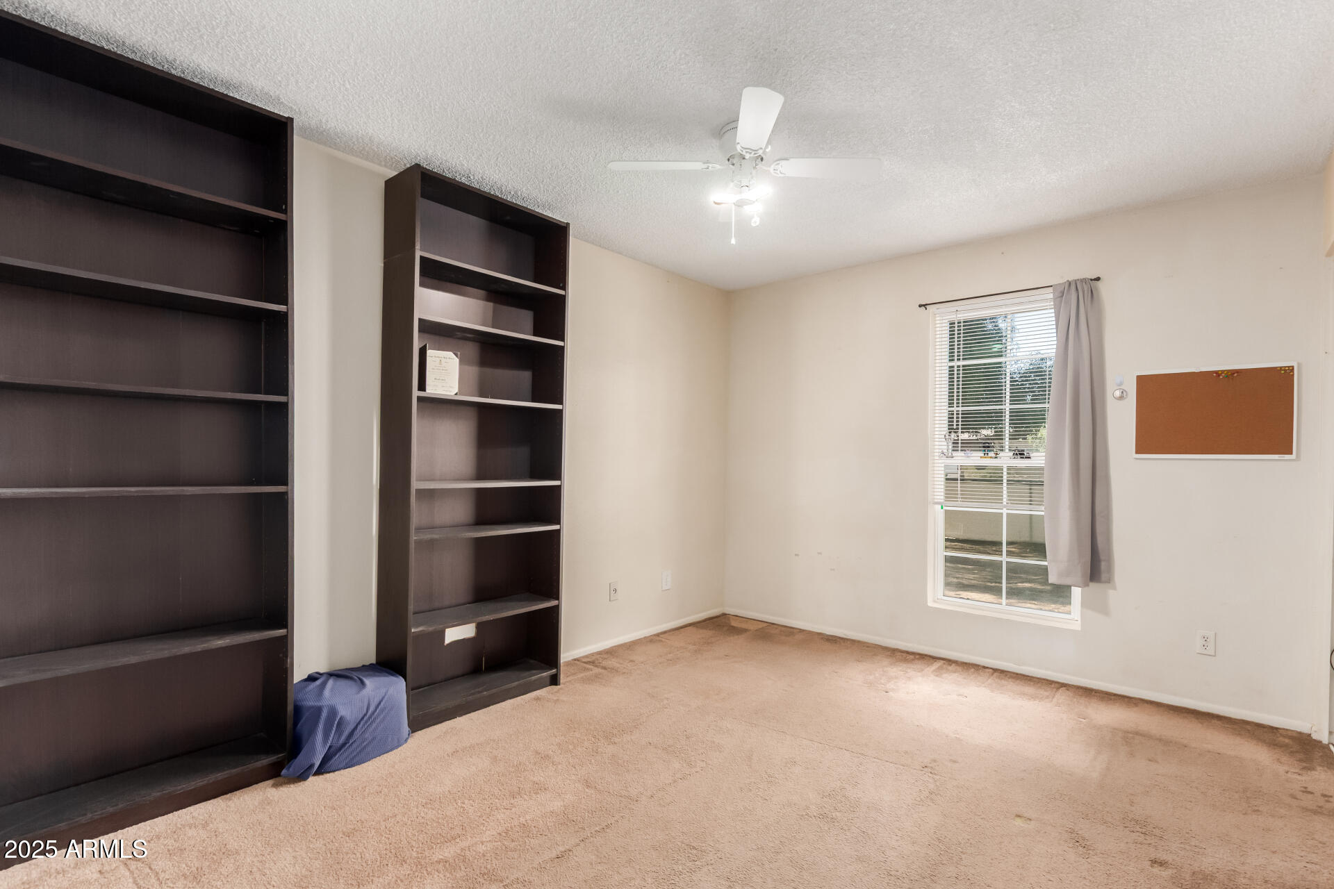 3251 West Cortez Avenue Phoenix, AZ 85029 - Photo 17 of 32 a view of an empty room with a window and cabinet