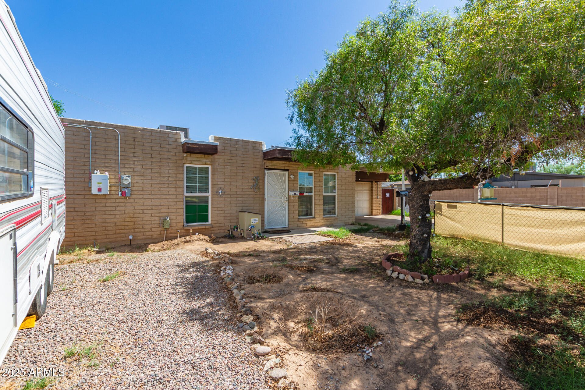 3251 West Cortez Avenue Phoenix, AZ 85029 - Photo 27 of 32 a front view of a house with a yard