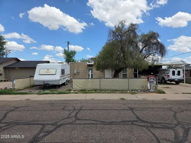 a backyard of a house with lots of green space