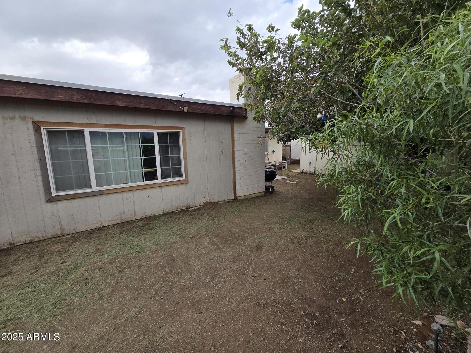 3251 West Cortez Avenue Phoenix, AZ 85029 - Photo 29 of 32 a view of a house with a backyard