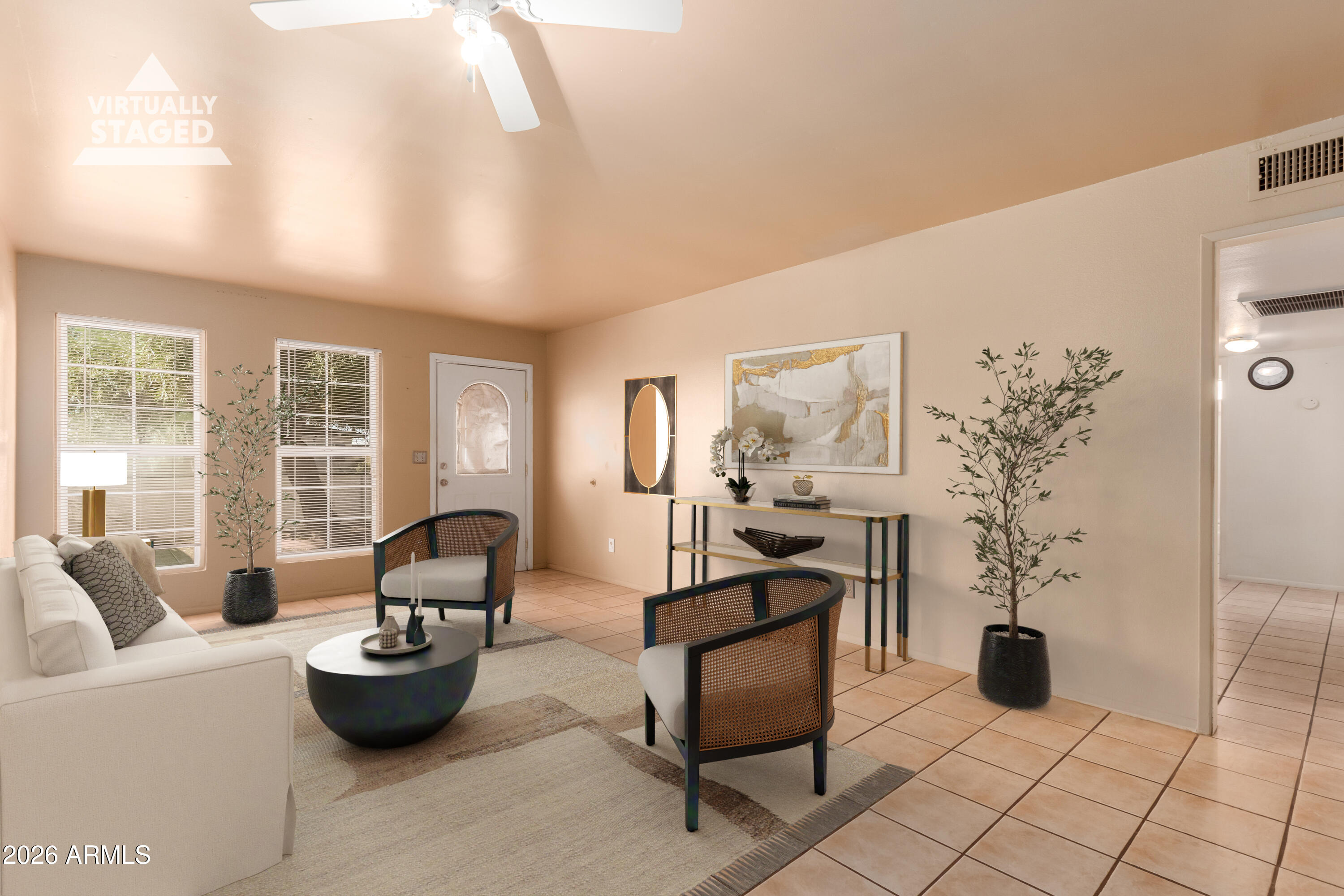 3251 West Cortez Avenue Phoenix, AZ 85029 - Photo 3 of 32 a living room with furniture and a potted plant