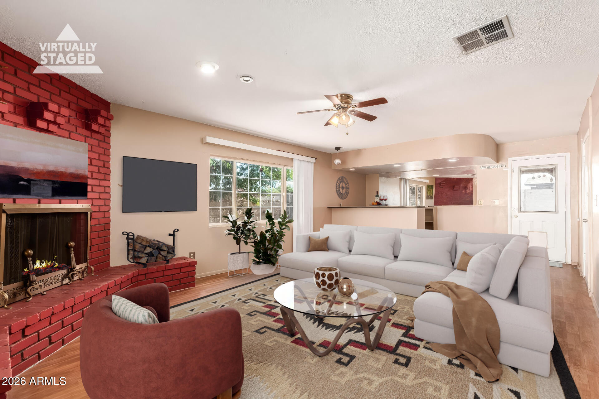 3251 West Cortez Avenue Phoenix, AZ 85029 - Photo 7 of 32 a living room with furniture and a flat screen tv