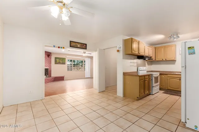 a kitchen with a sink cabinets and window