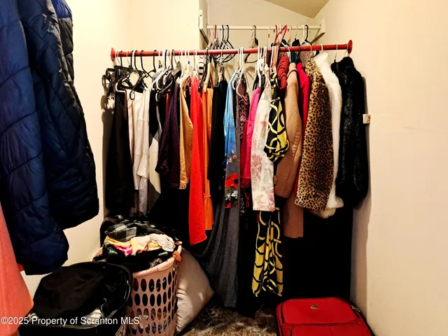 a view of a dining room with furniture and a window