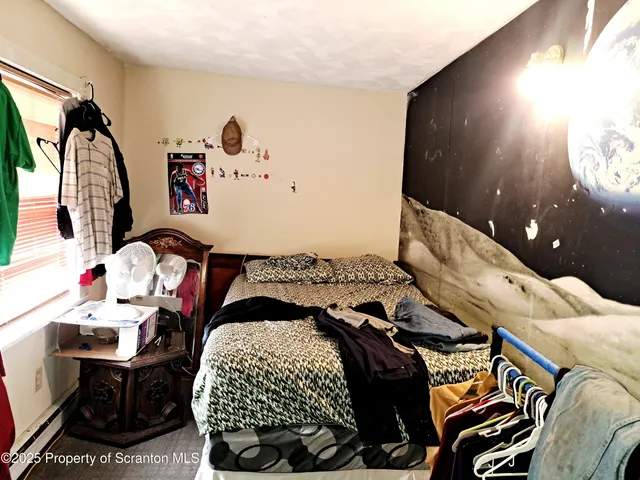 a bathroom with a sink toilet and a mirror