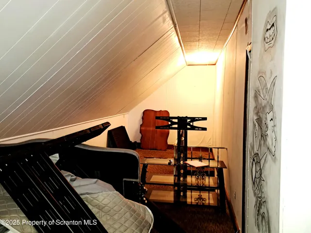 a bedroom with bed and a window