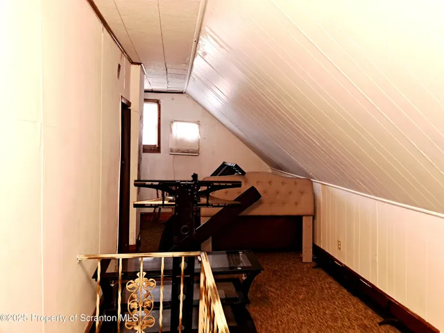 a bedroom with a bed and cabinets