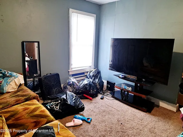 wooden floor and utility room with a sink