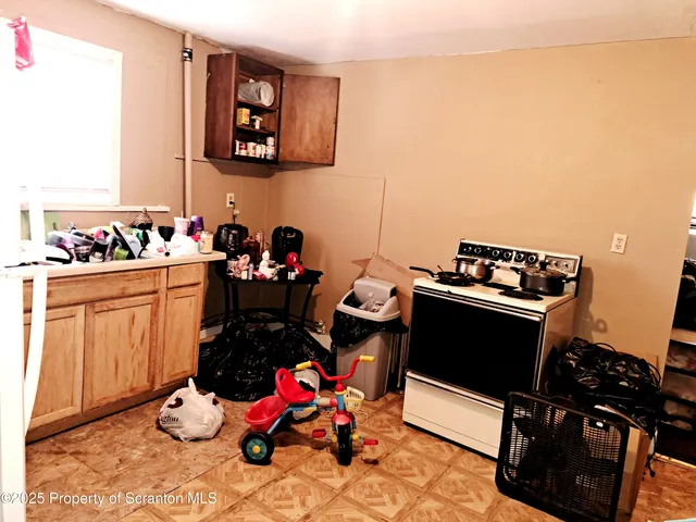 a room with cabinets and wooden floor