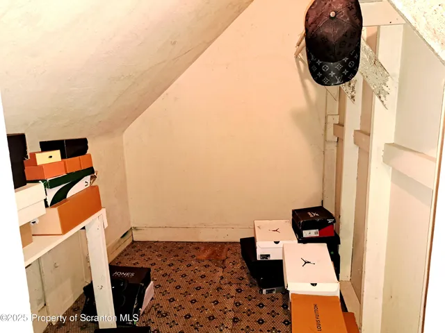 a view of a chairs and tables in the patio and a fountain in yard