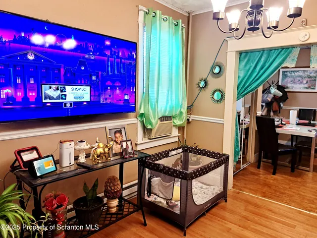 a outdoor living space with furniture and a flat screen tv