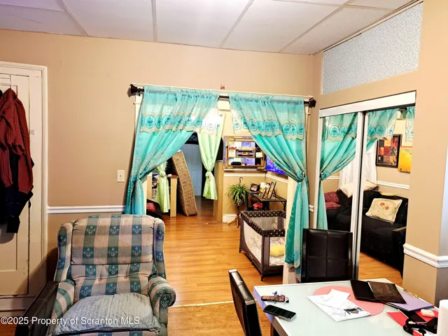 a kitchen with refrigerator and cabinets