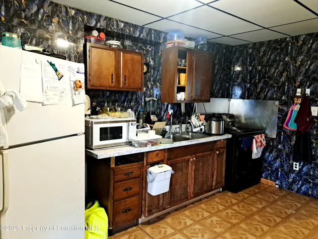 a bathroom with a sink toilet and a mirror