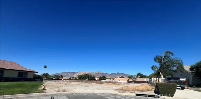 a view of a road with a building in the background