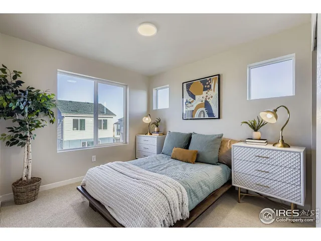 a bedroom with bed and a window