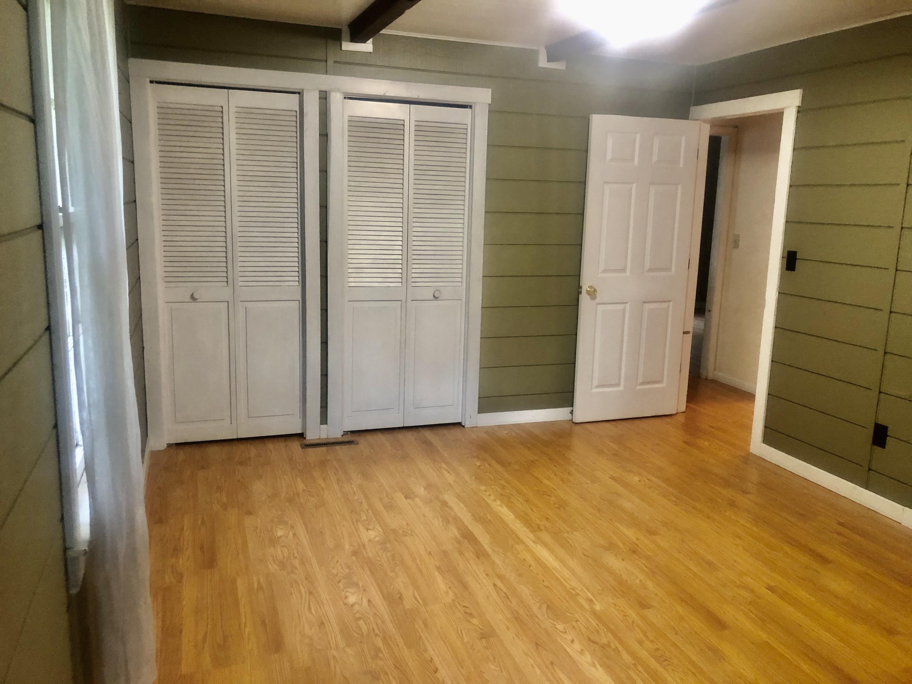 5453 Providence Church Road Ferrum, VA 24088 - Photo 7 of 16 an empty room with a wooden door