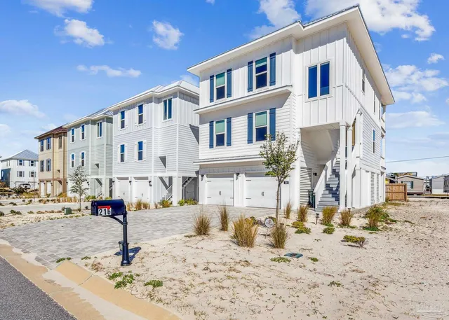 a view of a house with snow on the road