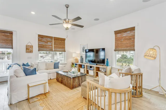 a kitchen with stainless steel appliances granite countertop a refrigerator and white cabinets