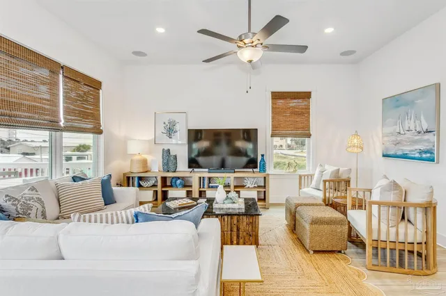 a kitchen with stainless steel appliances granite countertop a sink a stove and a wooden floors