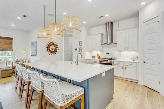 a bedroom with bed and a chandelier
