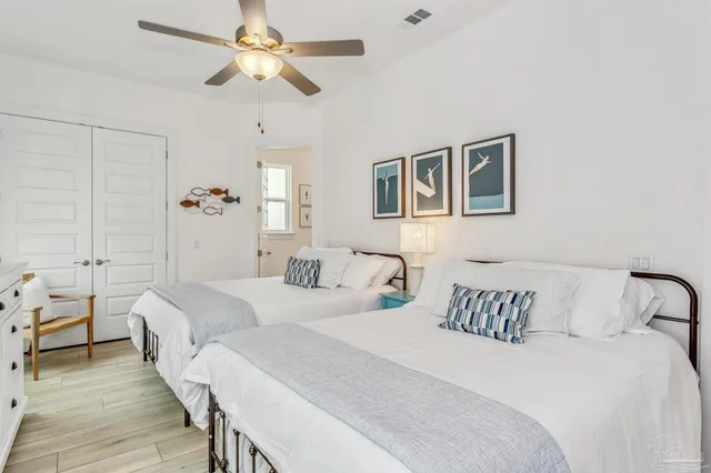 a bedroom with a large bed and a large window