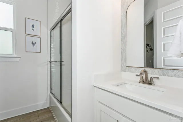 a bathroom with a double vanity sink and a mirror