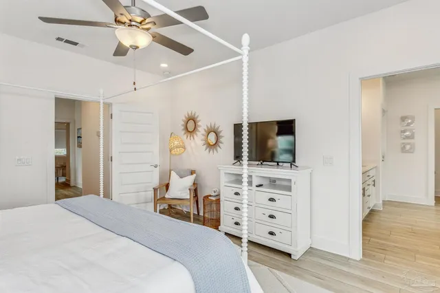 a bathroom with a granite countertop sink a mirror and shower