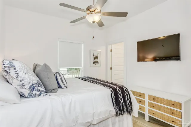 a view of a backyard with lawn chairs